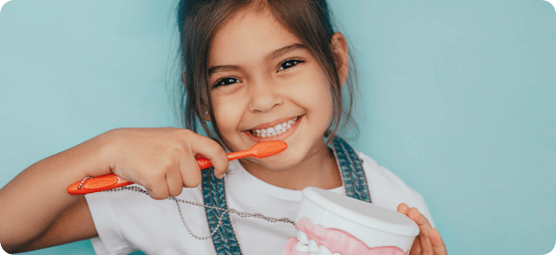 Girl brushing her teeth